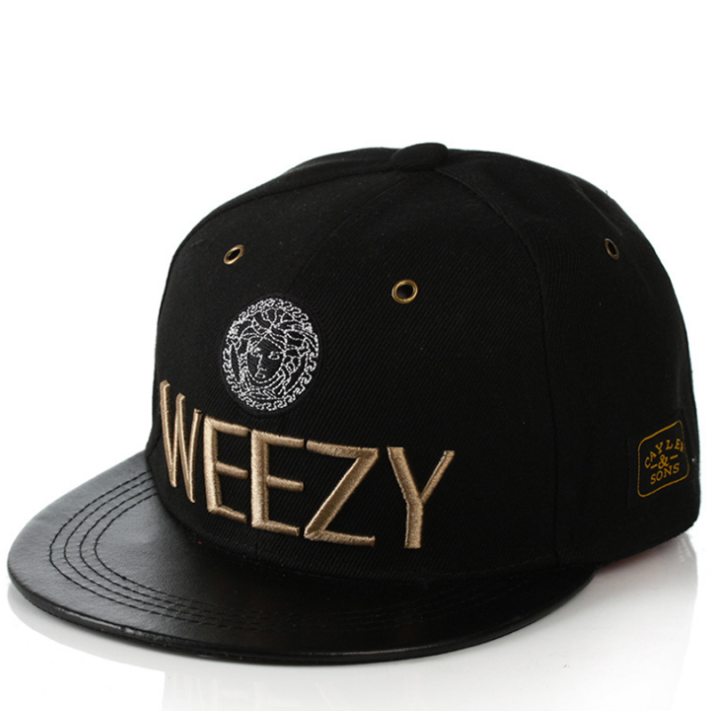 Metallic gold embroidery and metal eyelets snapback fitted cap